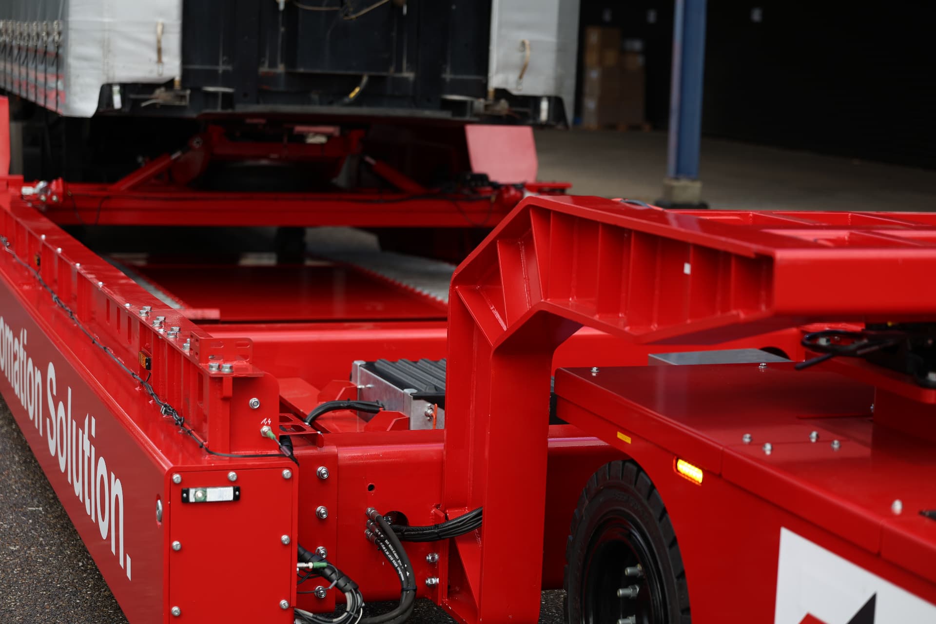 CEYAS trailer carrier vehicle moving a trailer in a logistics yard
